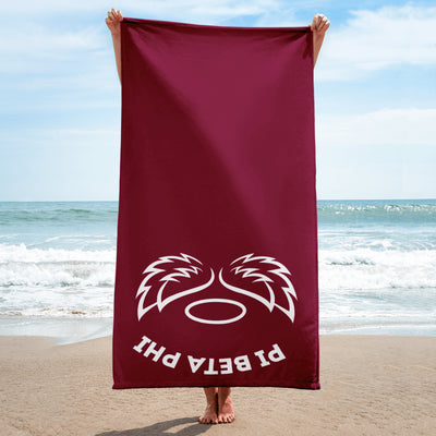 Pi Beta Phi Angel Beach Towel held up by model at beach