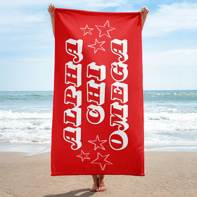 Alpha Chi Omega Starry Beach Towel held up by model at beach