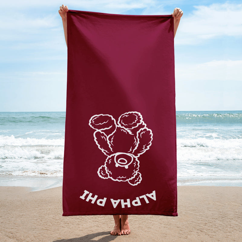 Alpha Phi Bear Beach Towel held up by model at beach