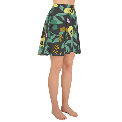 Skirt with floral pattern and 'Kappa Alpha Theta' letters on a black background