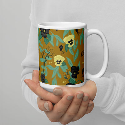 Kappa Alpha Theta Floral Sorority Mug in gold 15 oz size in model's hands