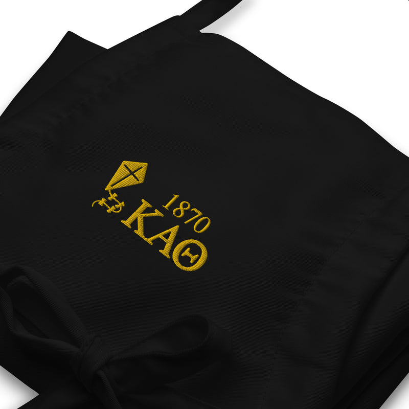 theta kite apron in black in close up view