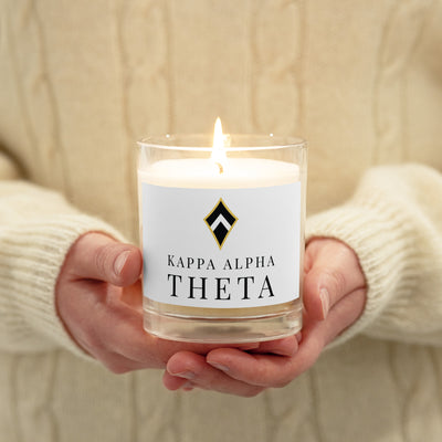 Theta Logo Glass Jar Soy Candle in model's hands