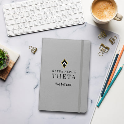 Theta Brand Logo Hardcover Journal in silver in lifestyle setting