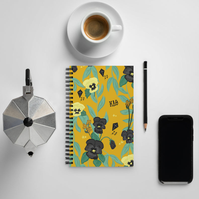 Kappa Alpha Theta Pansy Floral Print Spiral Notebook with coffee