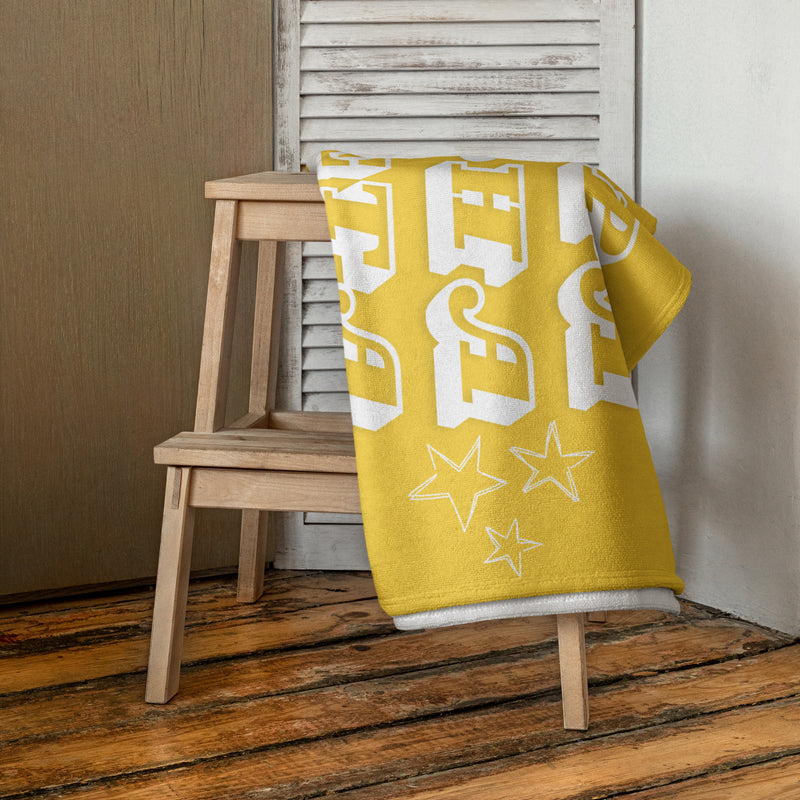 Kappa Alpha Theta Beach Towel shown folded over chair