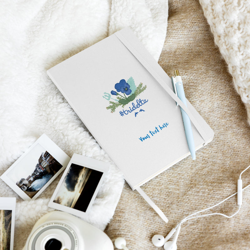 Tri Delta Pine Poseidon Hardcover Journal in white in lifestye setting