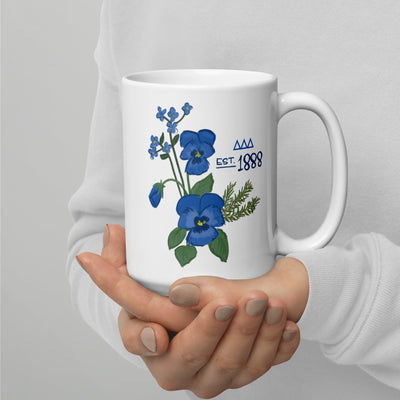 Tri Delta 1888 15 oz mug shown in model's hands with handle on right