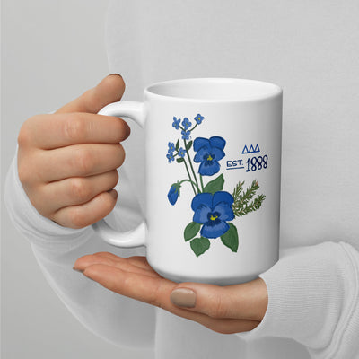 tri delta 1888 white ceramic mug shown in model's hands in 15 oz size