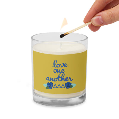 Tri Delta Sorority Soy Candle shown being lighted with a match