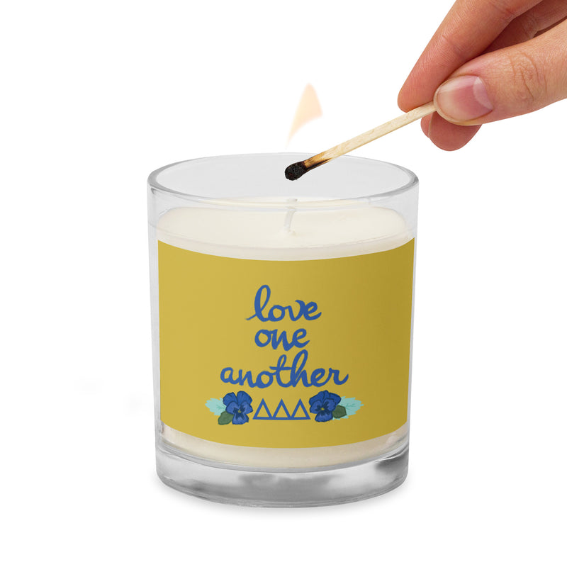 Tri Delta Sorority Soy Candle shown being lighted with a match