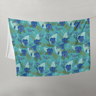 Tri Delta Pansy Floral Print Teal Throw Blanket shown on clothesline