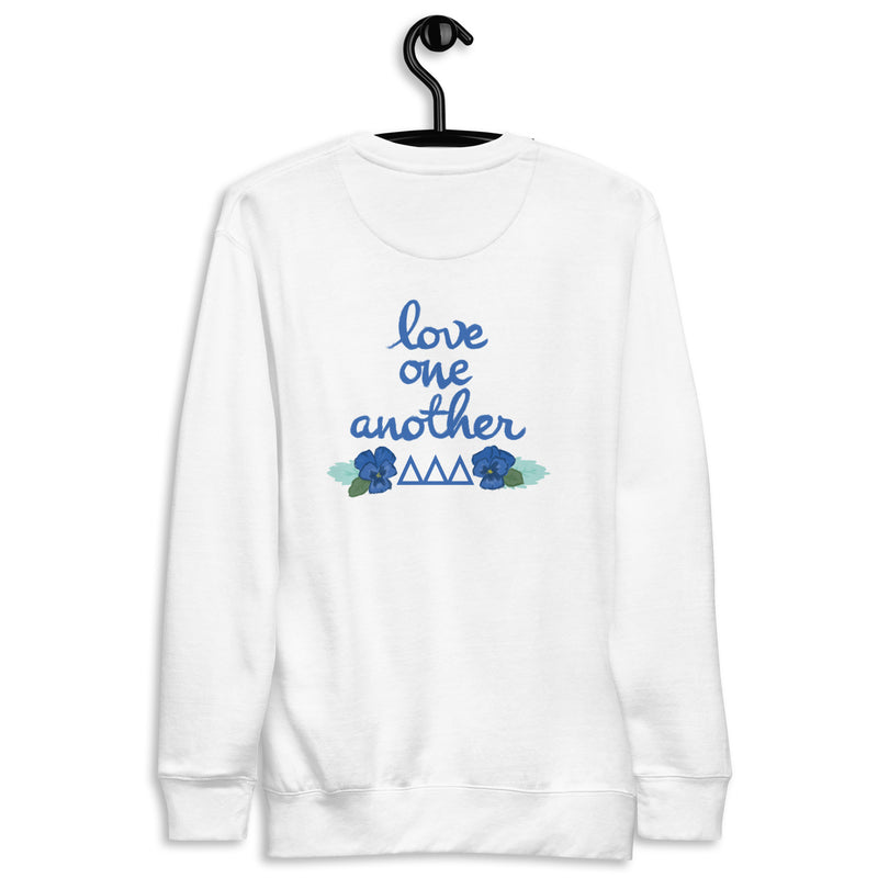 Tri Delta Sorority Sweatshirt shown hang9ing on a hanger