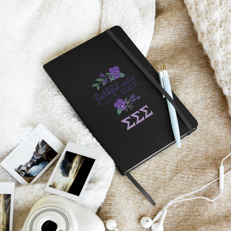 Tri Sigma Faithful Hardcover Journal in lifestyle setting in black