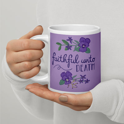 Tri Sigma Motto Mug shown in 20 oz size in model's hands with handle on left
