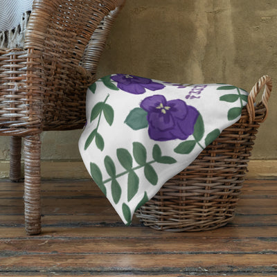 Tri Sigma Violet Print Minky Blanket shown in basket