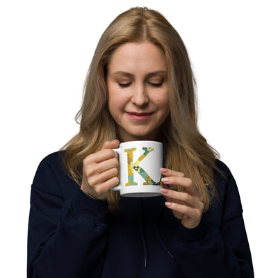 Kappa Alpha Theta Floral Filled Letters White Glossy Mug in woman's hand, 11 oz