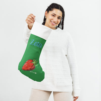 Zeta Strawberry Holiday Stocking in model's hand