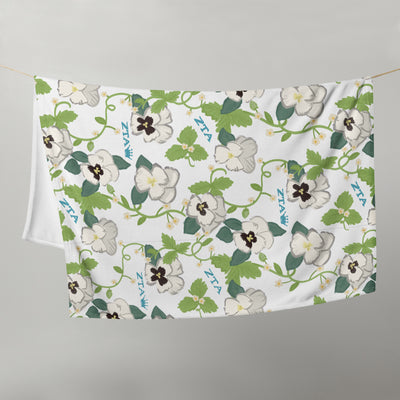 Zeta Tau Alpha Violet Print Blanket shown hanging on clotheseline