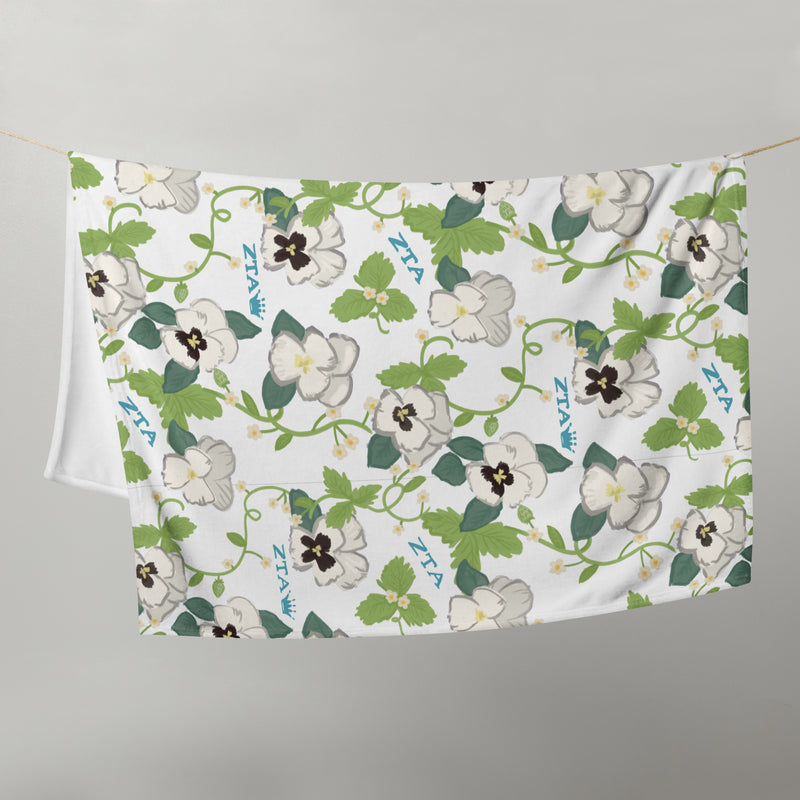 Zeta Tau Alpha Violet Print Blanket shown hanging on clotheseline