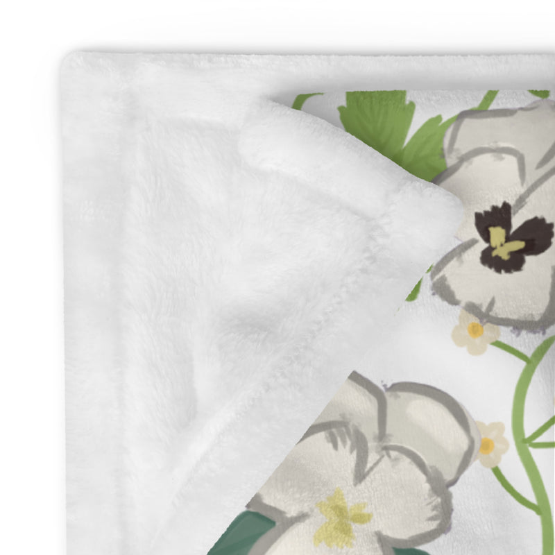 Zeta Tau Alpha Violet Print Blanket showing solid white on reverse side of floral print