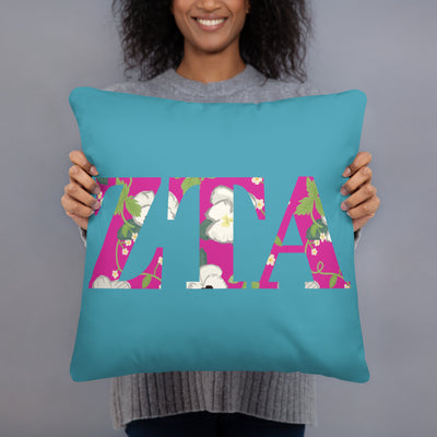 Zeta Tau Alpha Letters Pillow in turquoise in 18" x 18" size shown in model's hands