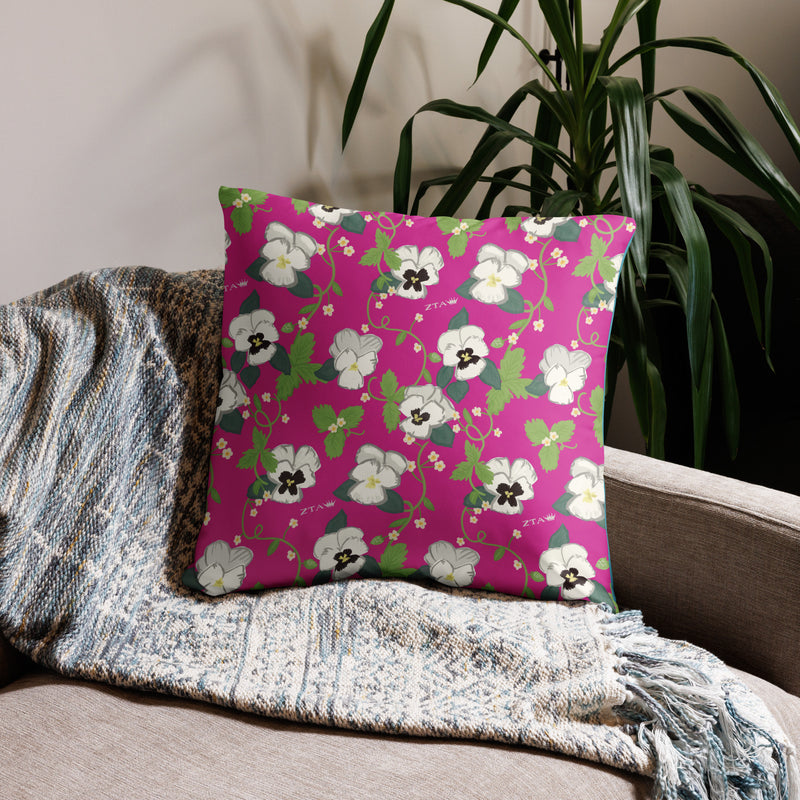 Zeta Tau Alpha Letters Pillow in 22" x 22" size showing white violet print in bright pink on couch