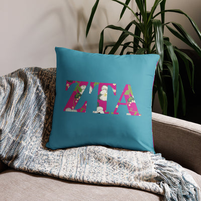 Zeta Tau Alpha Letters Pillow in 22" x 22" size in turquoise shown on couch