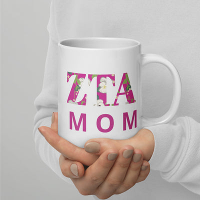 Zeta Tau Alpha Mom Mug in 20 oz size showing motto design in model's hands