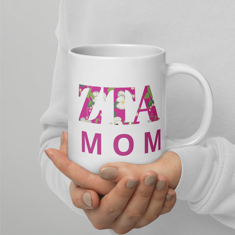 Zeta Tau Alpha Mom Mug in 20 oz size showing motto design in model&