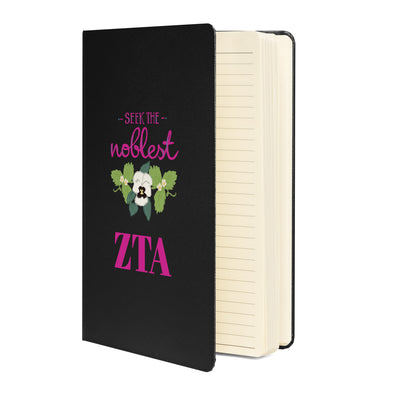 Zeta Seek the Noblest Motto Journal in black showing lined pages