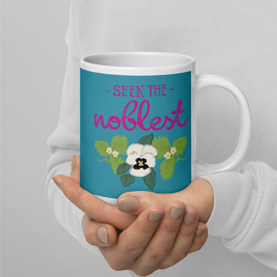 Zeta Tau Alpha Seek the Noblest Motto Mug in Turquoise in 20 oz size in model's hands