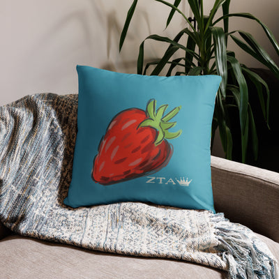 Zeta Tau Alpha Sorority Pillow with strawberry, crown and ZTA design in 22" x 22" size shown on couch