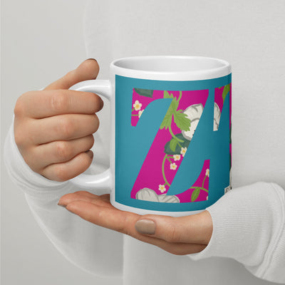 Zeta Tau Alpha Letters Turquoise Mug shown in 20 oz size in model's hands