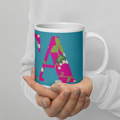Zeta Tau Alpha Letters Turquoise Mug shown in 20 oz size in model's hands