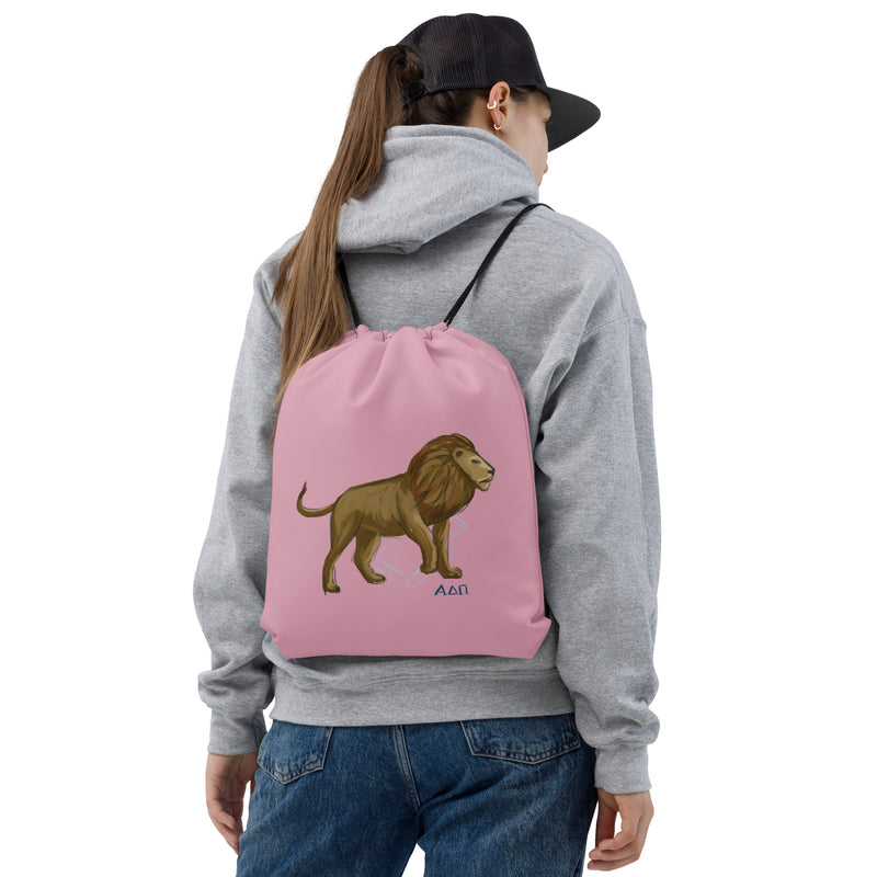 Alpha Delta Pi Alphie Drawstring Bag in pink shown on woman&