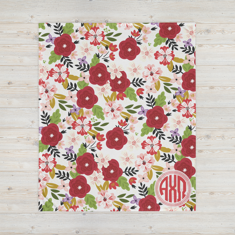 Alpha Chi Omega Modern Floral Print throw blanket in white shown full size with monogram