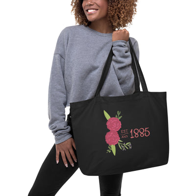 Alpha Chi Omega 1885 Large Organic Cotton Tote Bag in black on woman's arm