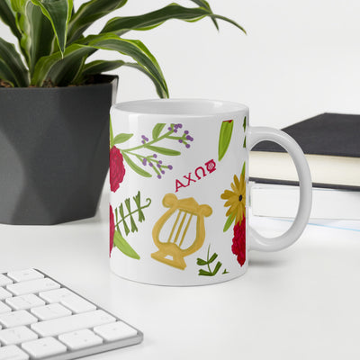 Alpha Chi Omega mug ceramic mug in floral print 11 oz site shown in office environment. 