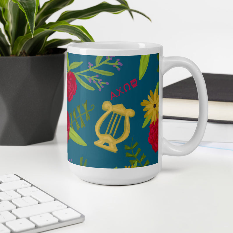 Alpha Chi Omega Floral Print Teal Glossy Mug shown in 15 oz size in office environment