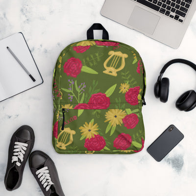 Alpha Chi Omega green floral backpack shown with office items