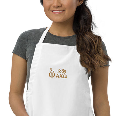 Alpha Chi Omega 1885 Lyre Embroidered Apron in white on young woman