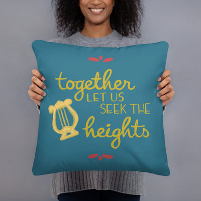 Alpha Chi Omega Together Let Us Seek the Heights Teal Pillow shown with woman