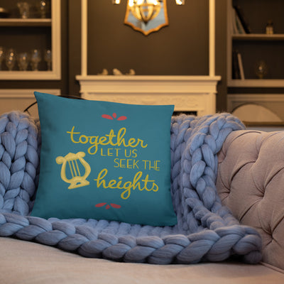 Alpha Chi Omega Together Let Us Seek the Heights Teal Pillow shown on couch