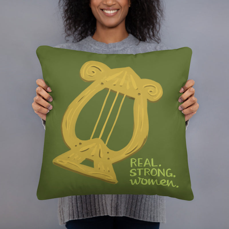 Alpha Chi Omega Real. Strong. Women. Olive Green Pillow shown with woman holding it