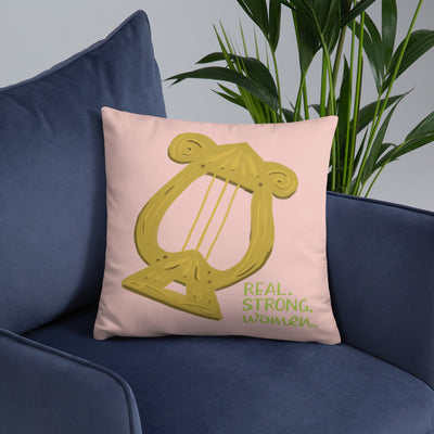 Alpha Chi Omega Real Strong Women Pillow, Pink shown on blue chair