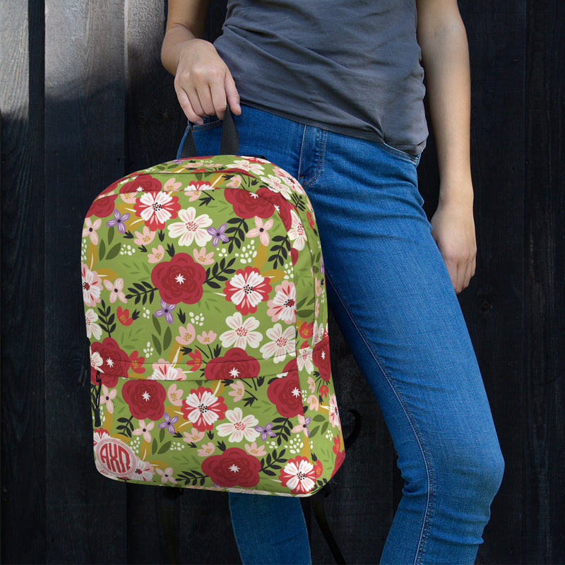 Alpha Chi Omega Modern Floral and Greencastle Backpack shown with woman holding it