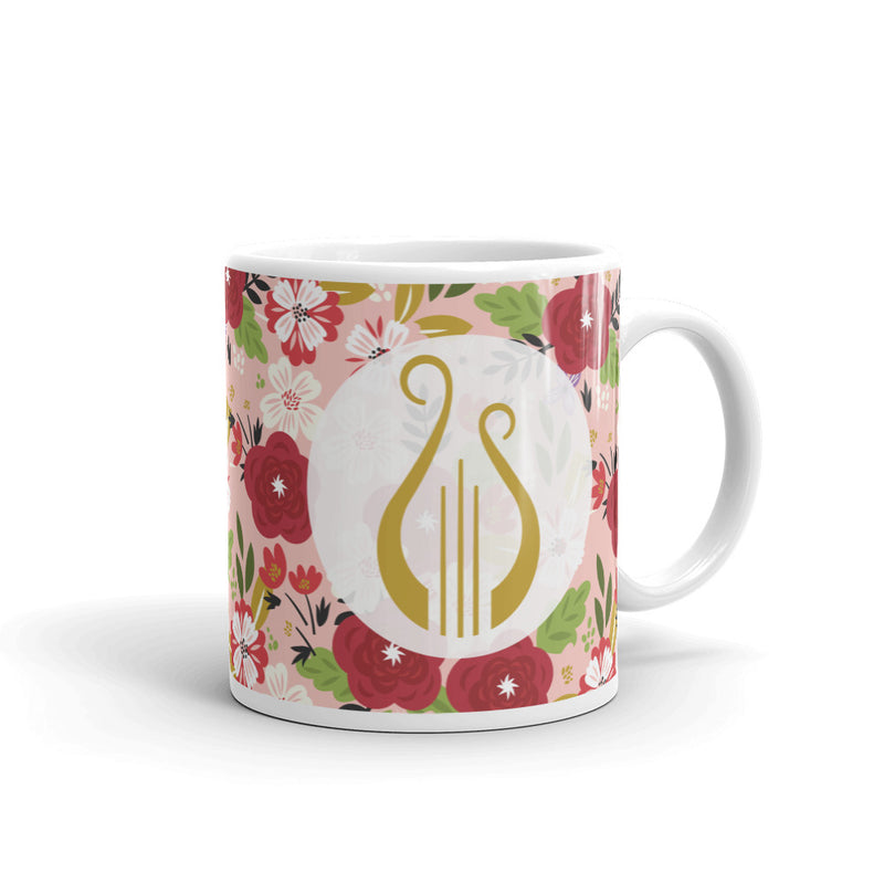 Alpha Chi Omega Modern Floral Print Hera Pink Mug with Lyre shown with handle on right