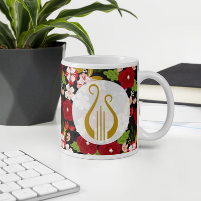 Alpha Chi Omega Modern Floral Print Ebony Mug with Lyre shown in office environment