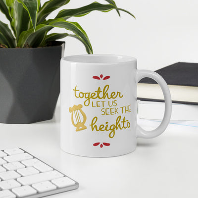 Alpha Chi Omega Together Let Us Seek the Heights White Mug shown with plant in office